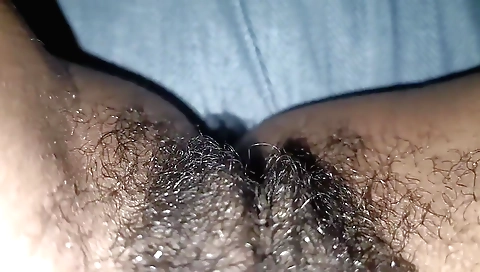 Indian hairy brunette gets naked and plays with her hairy pussy