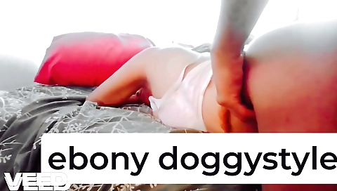 Indian yoga instructor teaching students 3rd yoga pose