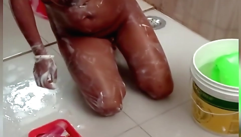 Big boobed girl with a large booty is going to shower