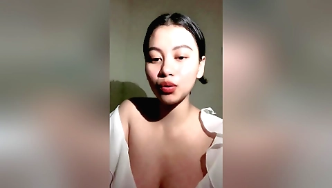Brunette indian teen is naked in bed and playing with sex toy