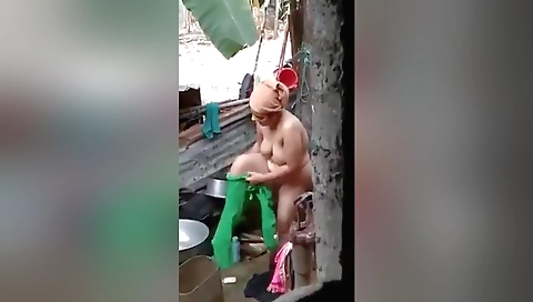 Chubby brunette in black lingerie masturbates outdoors