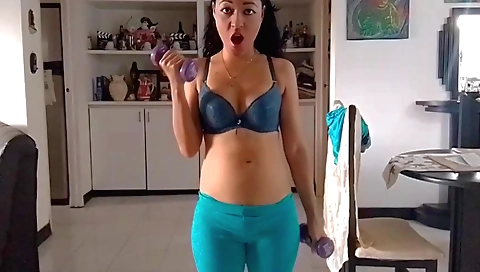 Sexy brunette in sexy red lingerie is stripping naked