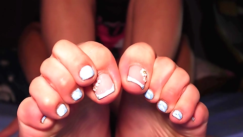 Amateur girl with large natural breasts is playing with her feet