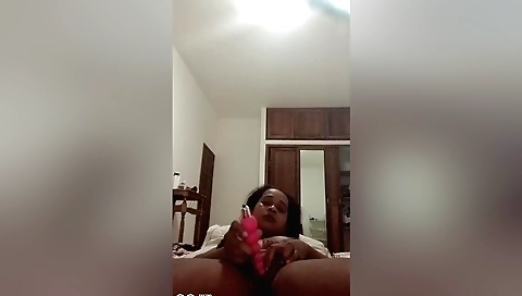 Sexy brunette has a huge dildo on her shaved pussy