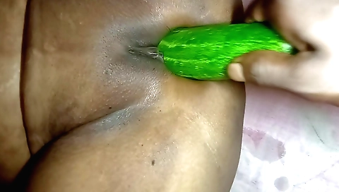 Boudi with big ass fucks her cucumber in doggy style