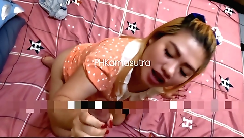 Redhead babe with a nice face is having fun in the bed