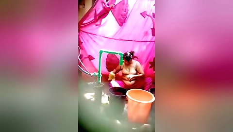 Bhabhi undresses in bathing room to make love to her self