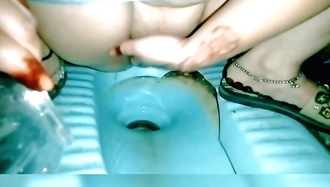 Indian woman in white t-shirt masturbates in bathroom