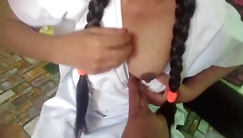 Brunette schoolgirl in a black outfit and schoolmate in a red pants