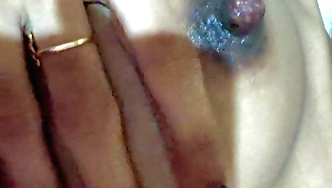 Female solo with her body in her bed with a vibrator