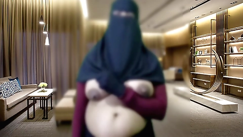 Indian girl is masturbating in her bed with a dildo