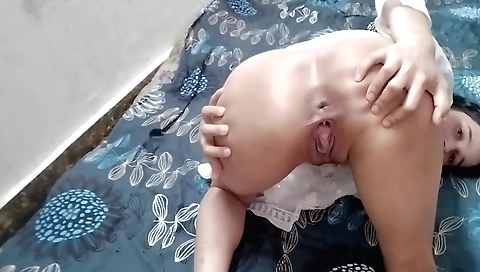 Indian chick is dressed up in a white dress and a sexy dress